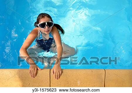 Girl 11 with goggles in swimming pool, Provence, France View Large Photo Image Stock Image - Girl 11 with goggles in swimming pool, Provence, France. Fotosearch