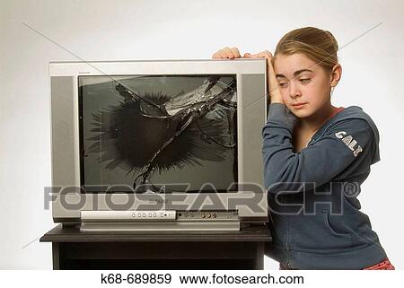 Girl, 12, with broken tv View Large Photo Image Stock Photo - Girl, 12, with broken tv. Fotosearch
