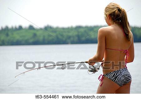 Stock Image - girl 13 fishing alone. Fotosearch