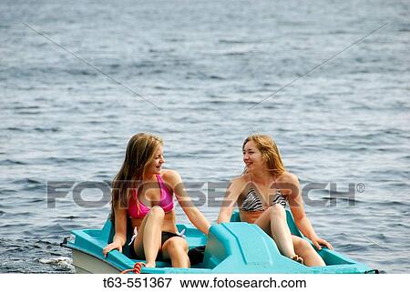 girl 13, girl 18 yrs on lake in paddleboat View Large Photo Image Stock Photo - girl 13, girl 18 yrs on lake in paddleboat. Fotosearch