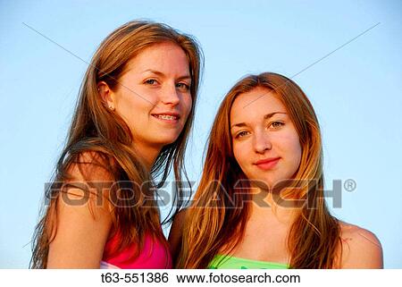 girl 13, girl 18 yrs standing together in swimsuits on beach View Large Photo Image Stock Photograph - girl 13, girl 18 yrs standing together in swimsuits on beach. Fotosearch