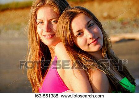 girl 13, girl 18 yrs standing together in swimsuits on beach View Large Photo Image Stock Photography - girl 13, girl 18 yrs standing together in swimsuits on beach. Fotosearch