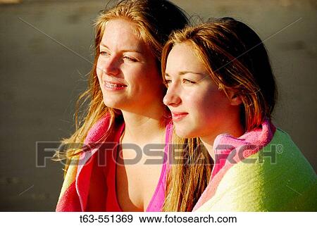 girl 13, girl 18 yrs together on beach with towel around them View Large Photo Image Stock Photo - girl 13, girl 18 yrs together on beach with towel around them. Fotosearch