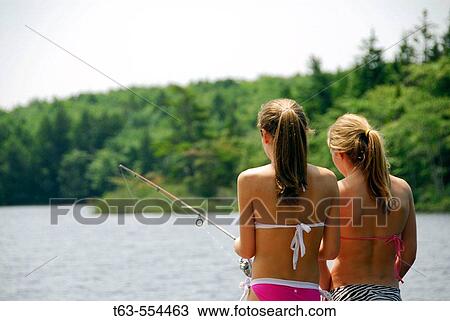girl 13 with girl 18 fishing together on dock at cottage View Large Photo Image Stock Image - girl 13 with girl 18 fishing together on dock at cottage. Fotosearch