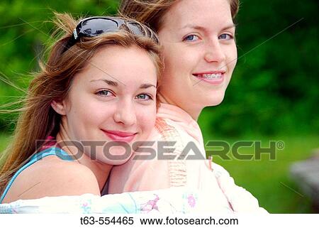 girl 13 with girl 18 sitting together at cottage View Large Photo Image Stock Photography - girl 13 with girl 18 sitting together at cottage. Fotosearch