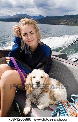 girl, 14, with her cocker spaniel, in a boat on a lake View Large Photo Image Stock Image - girl, 14, with her cocker spaniel, in a boat on a lake. Fotosearch