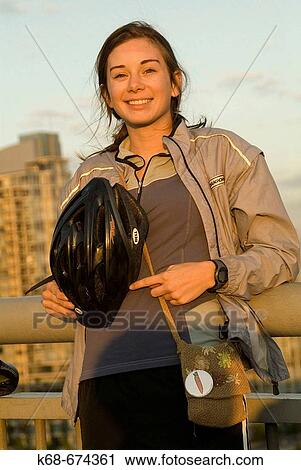 Stock Image - Girl, 16, with bike helmet, Vancouver, BC, Canada. Fotosearch