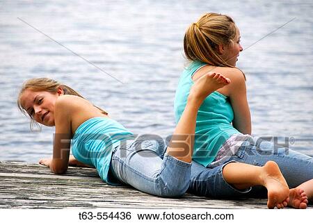 girl 18 looking at camera girl 13 looking out at lake View Large Photo Image Stock Photograph - girl 18 looking at camera girl 13 looking out at lake. Fotosearch
