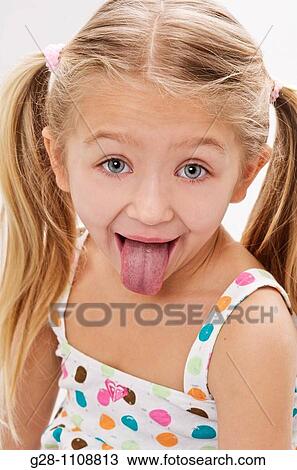 girl 7 pulling her tongue out View Large Photo Image Stock Image - girl 7 pulling her tongue out. Fotosearch