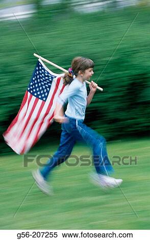 Girl (8 yrs) running with USA flag View Large Photo Image Stock Photography - Girl (8 yrs) running with USA flag. Fotosearch