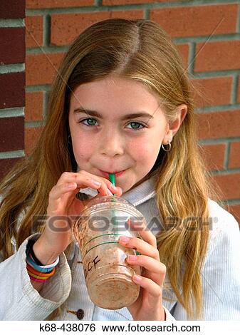 Girl, 9, with drink. View Large Photo Image Stock Photograph - Girl, 9, with drink.. Fotosearch