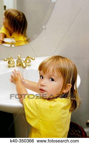 Girl (age 2) washing hands in bathroom sink View Large Photo Image Stock Photograph - Girl (age 2) washing hands in bathroom sink. Fotosearch