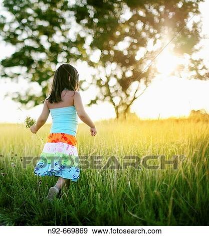 Girl, age 5, summer flower picking, View Large Photo Image Stock Photo - Girl, age 5, summer flower picking,. Fotosearch