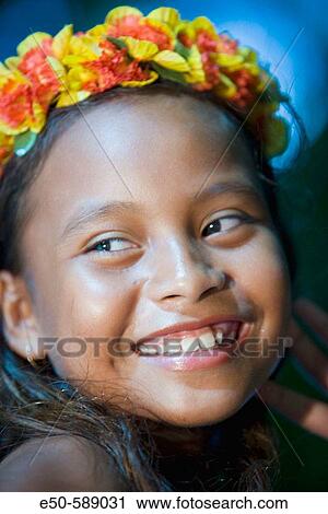 Stock Image - Girl (age 9) in Poynesian. Dance Outfit, Palau, Micronesia, Rock Islands, World Heritage Site, Western Pacific. Fotosearch