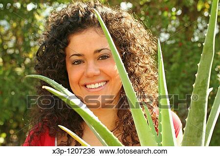 Girl and Aloe vera View Large Photo Image Stock Photograph - Girl and Aloe vera. Fotosearch
