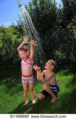 girl and boy having a shower outdoors, Switzerland View Large Photo Image Stock Image - girl and boy having a shower outdoors, Switzerland. Fotosearch