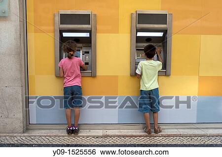 Girl and Boy in Cash Point View Large Photo Image Stock Photograph - Girl and Boy in Cash Point. Fotosearch