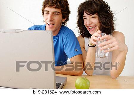 Girl and boy with laptop View Large Photo Image Picture - Girl and boy with laptop. Fotosearch