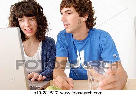 Girl and boy with laptop View Large Photo Image Stock Photo - Girl and boy with laptop. Fotosearch
