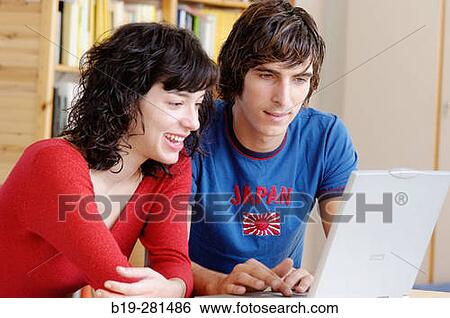 Girl and boy with laptop View Large Photo Image Stock Photograph - Girl and boy with laptop. Fotosearch