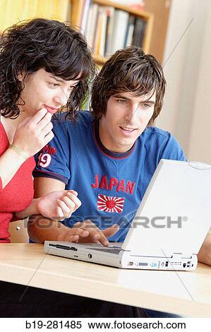 Girl and boy with laptop View Large Photo Image Stock Photography - Girl and boy with laptop. Fotosearch