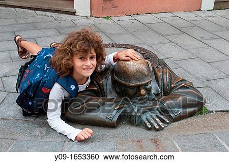 Girl and Bronze Sculpture Man at Work, Bratislava, Slovakia View Large Photo Image Stock Image - Girl and Bronze Sculpture Man at Work, Bratislava, Slovakia. Fotosearch