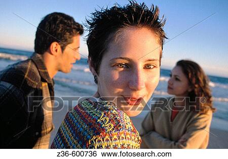 Girl and couple View Large Photo Image Stock Photograph - Girl and couple. Fotosearch