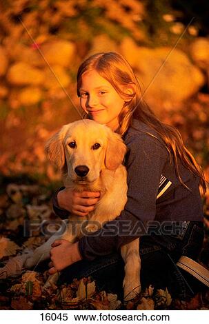 Girl and golden retriever View Large Photo Image Stock Photography - Girl and golden retriever. Fotosearch