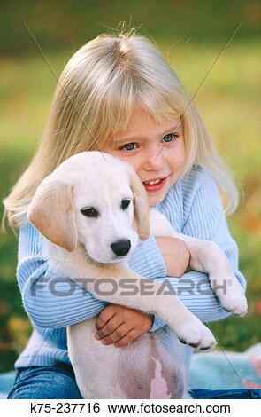 Girl and her puppy View Large Photo Image Stock Photograph - Girl and her puppy. Fotosearch