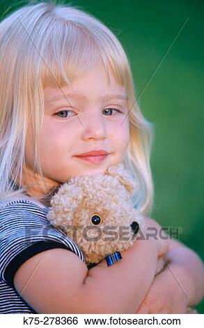 Girl and her teddy bear View Large Photo Image Stock Photograph - Girl and her teddy bear. Fotosearch