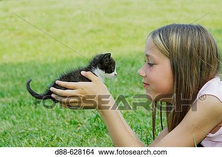 Girl and kitten View Large Photo Image Picture - Girl and kitten. Fotosearch
