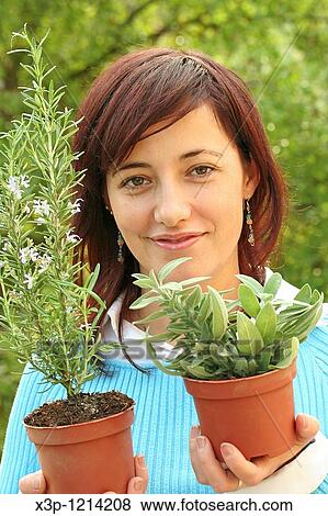Girl and medicinal herbs View Large Photo Image Stock Photo - Girl and medicinal herbs. Fotosearch