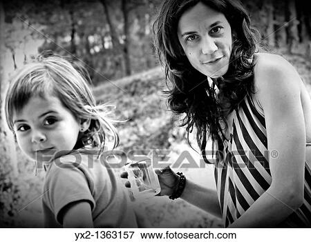 Girl and woman looking View Large Photo Image Stock Photo - Girl and woman looking. Fotosearch