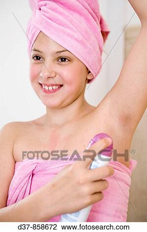 Girl applying deodorant after the shower View Large Photo Image Stock Image - Girl applying deodorant after the shower. Fotosearch