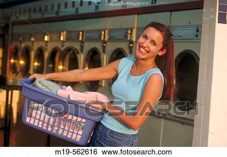 girl at a laundromat View Large Photo Image Stock Photograph - girl at a laundromat. Fotosearch