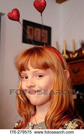 Girl at her 7th birthday party View Large Photo Image Stock Photography - Girl at her 7th birthday party. Fotosearch