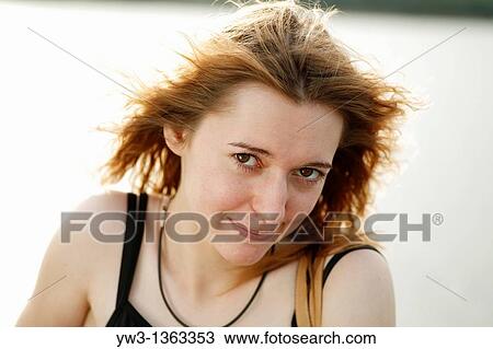Stock Image - Girl at sunset outdoors. Fotosearch