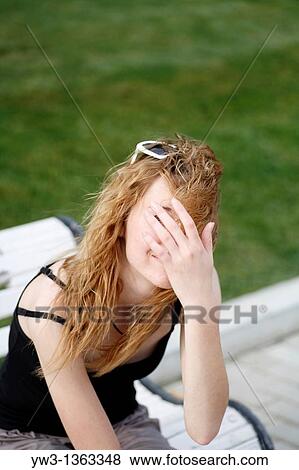 Stock Photo - Girl at sunset outdoors. Fotosearch