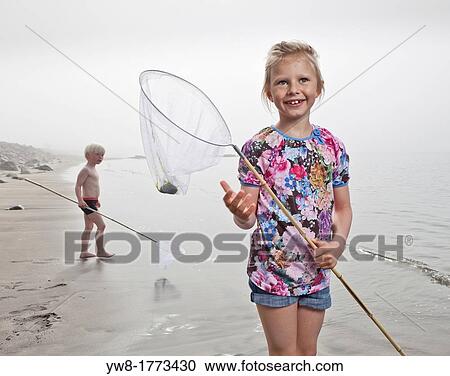 Girl at the beach fishing, Akranes, Iceland View Large Photo Image Stock Image - Girl at the beach fishing, Akranes, Iceland. Fotosearch