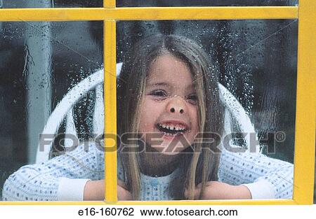 Girl behind yellow window View Large Photo Image Stock Image - Girl behind yellow window. Fotosearch