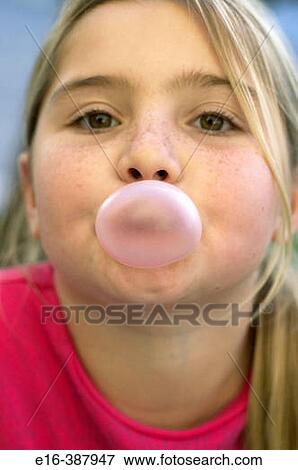 Stock Photo - girl blowing gum bubble. Fotosearch