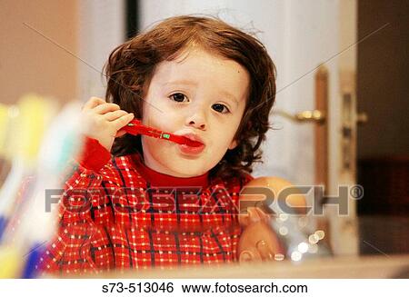 Girl brushing teeth View Large Photo Image Stock Photograph - Girl brushing teeth. Fotosearch