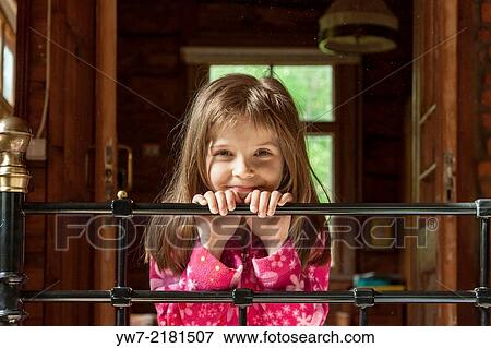 Girl by the bed. View Large Photo Image Stock Photo - Girl by the bed.. Fotosearch