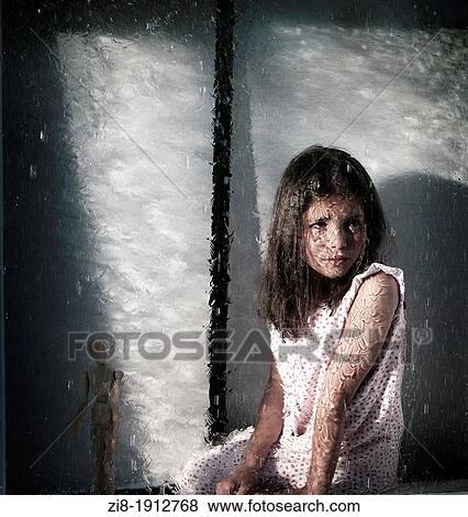 Girl by the window, looking at the heavy rain outside View Large Photo Image Stock Photo - Girl by the window, looking at the heavy rain outside. Fotosearch