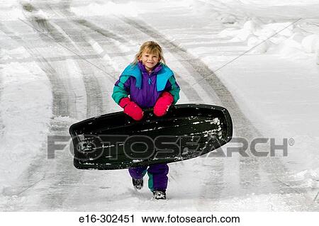 girl carrying sled in winter View Large Photo Image Stock Image - girl carrying sled in winter. Fotosearch