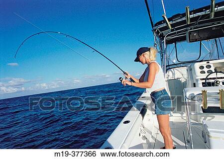 girl catching a fish from boat View Large Photo Image Stock Photograph - girl catching a fish from boat. Fotosearch