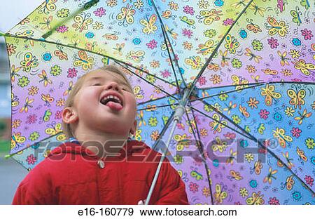 Stock Photo - Girl catching raindrops. Fotosearch