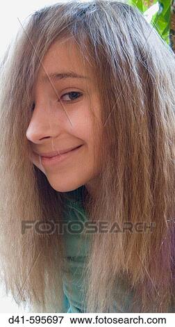 Stock Photo - Girl child face showing long crinkly hair. Fotosearch