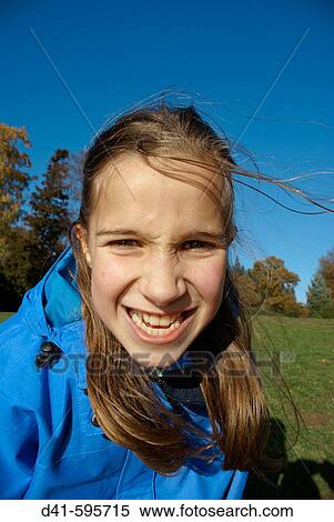 Girl child making aggressive face View Large Photo Image Stock Photography - Girl child making aggressive face. Fotosearch