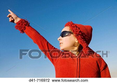 Stock Image - girl child mixed race in red hood photograph portrait. Fotosearch